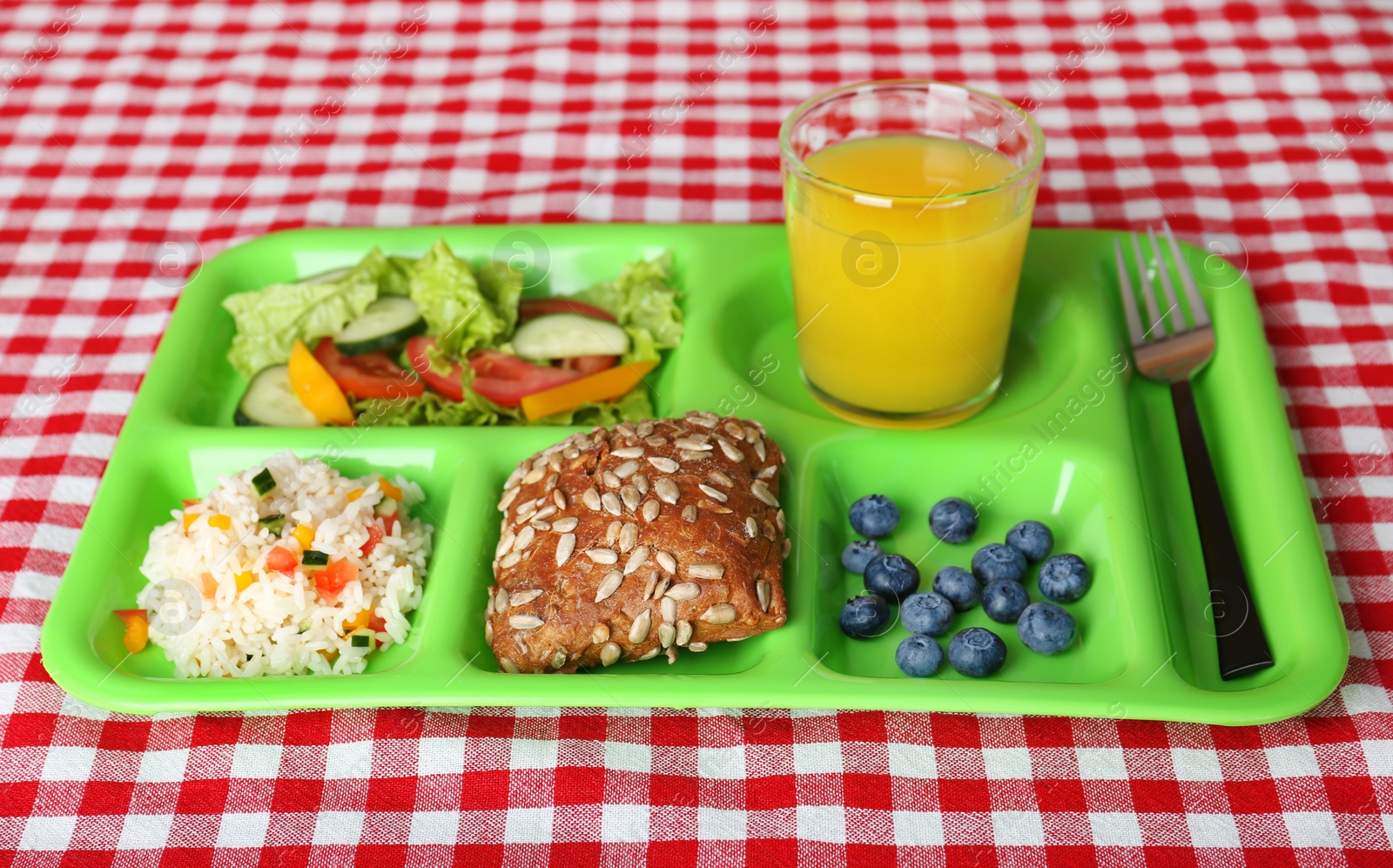 Photo of Serving tray with healthy food on table. School lunch