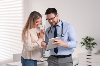 Photo of Professional doctor working with patient in hospital