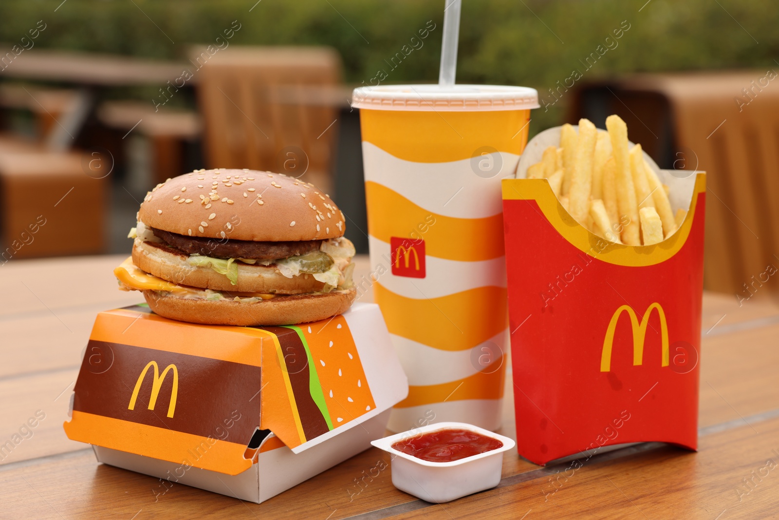 Photo of Lviv, Ukraine - October 9, 2023: McDonald's menu on wooden table outdoors