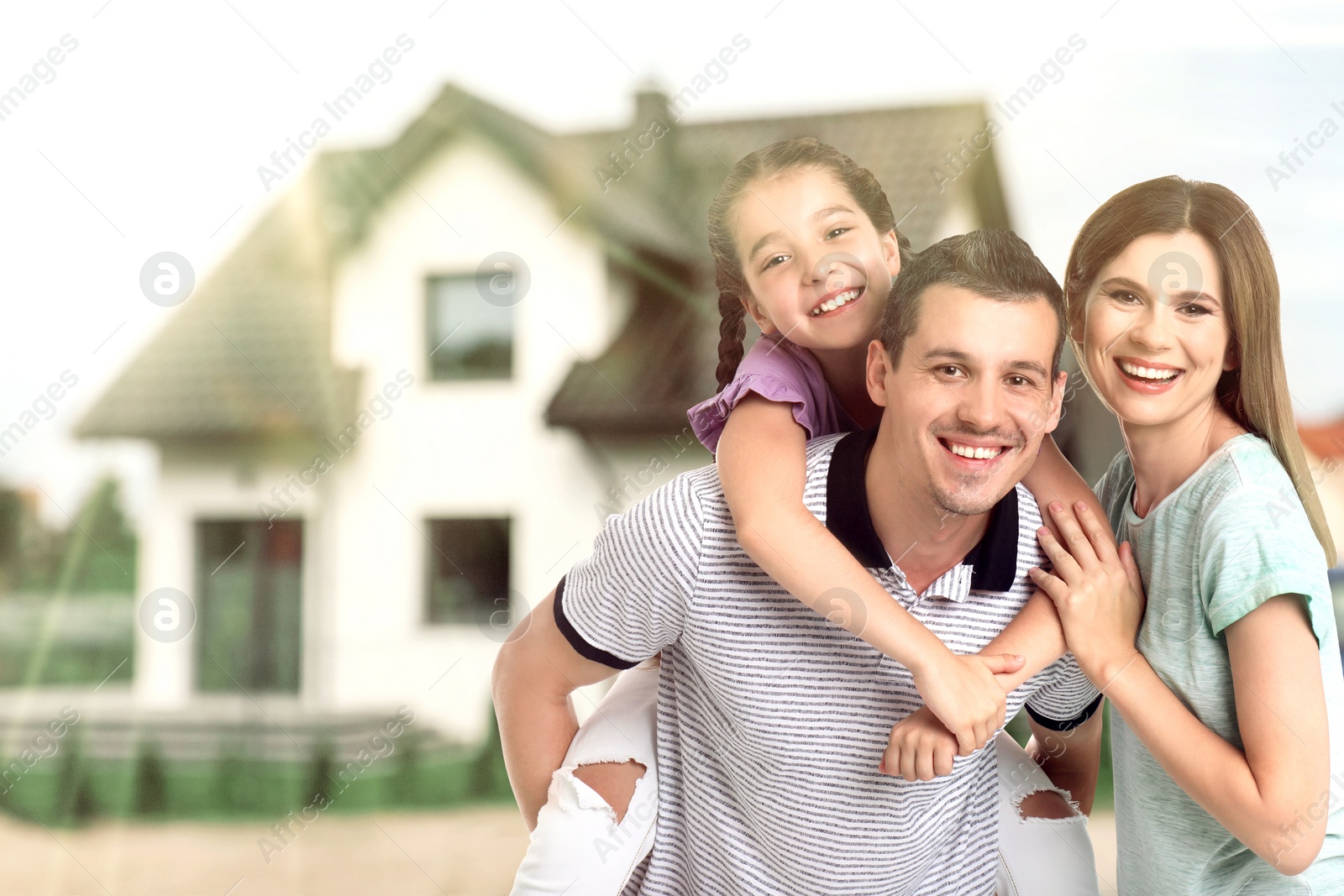 Image of Dream home. Happy family near big beautiful house. Space for text