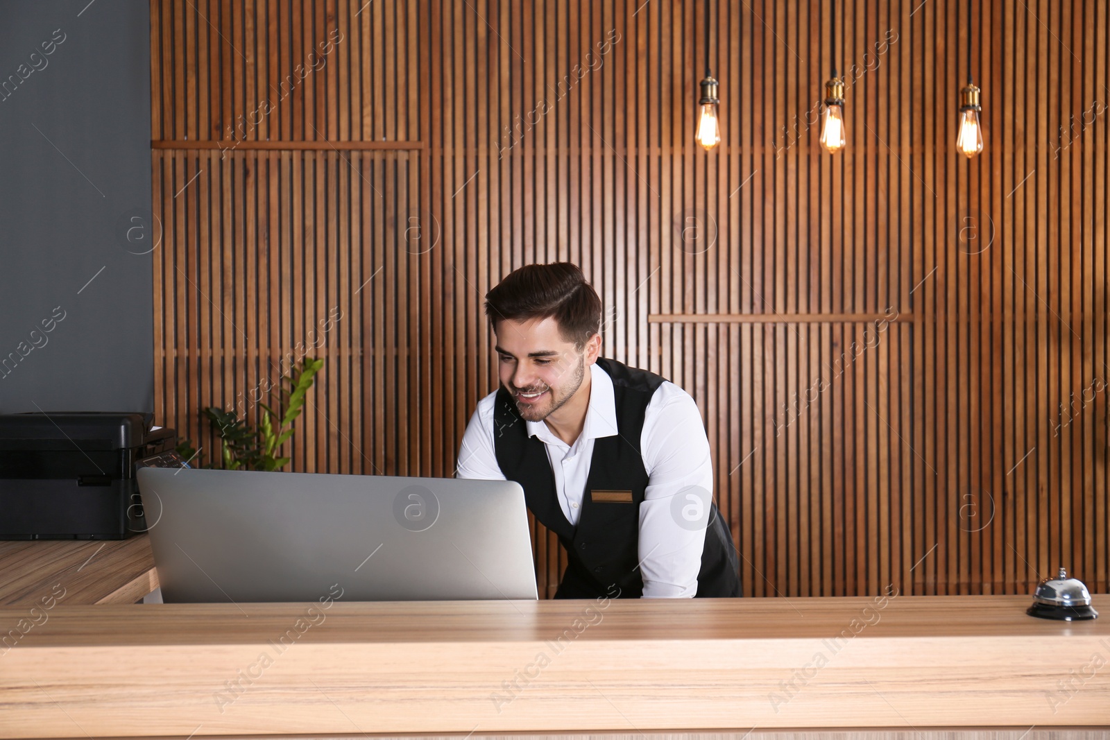 Photo of Portrait of receptionist at desk in lobby