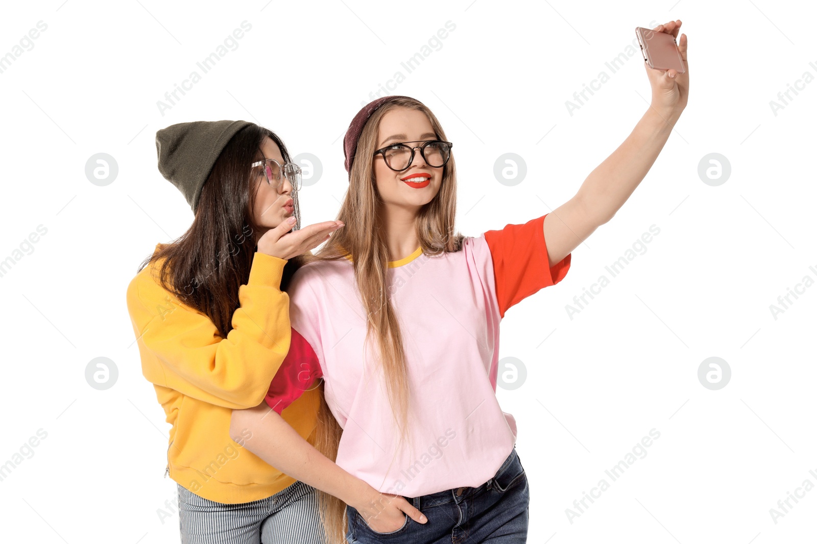 Photo of Attractive young women taking selfie on white background