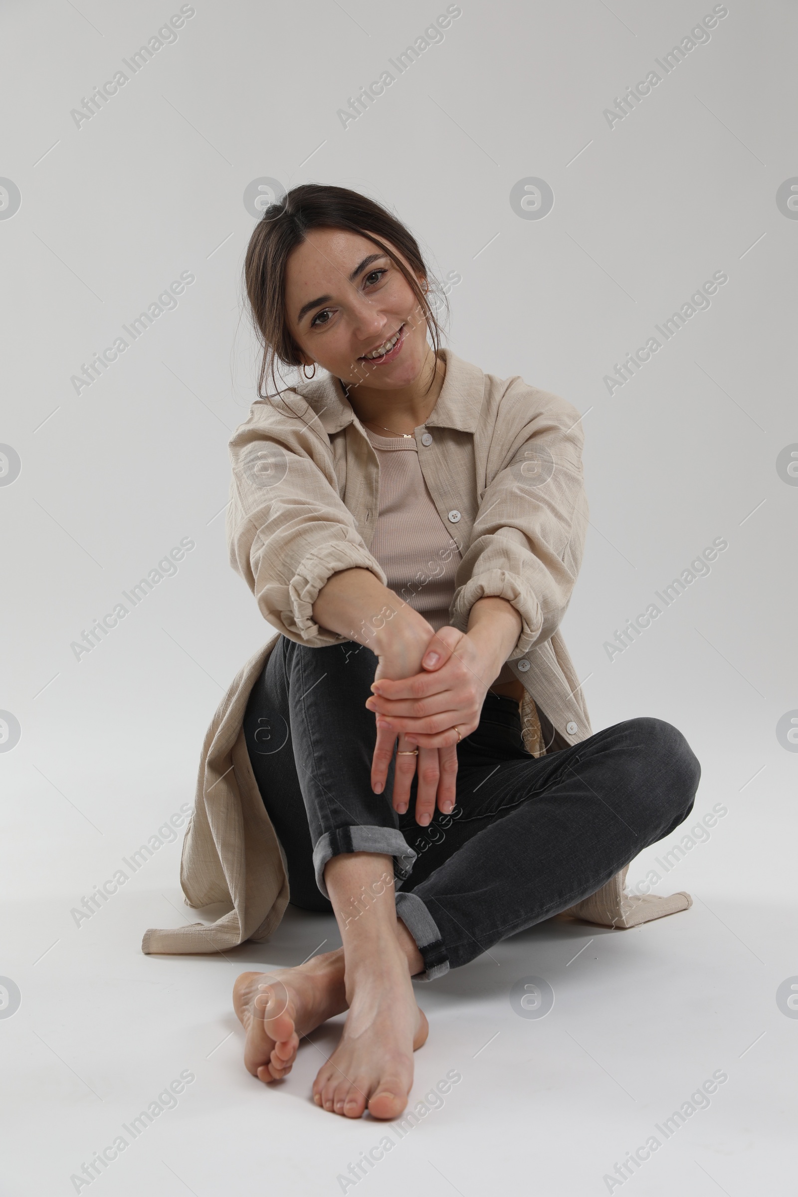 Photo of Portrait of beautiful woman on light grey background