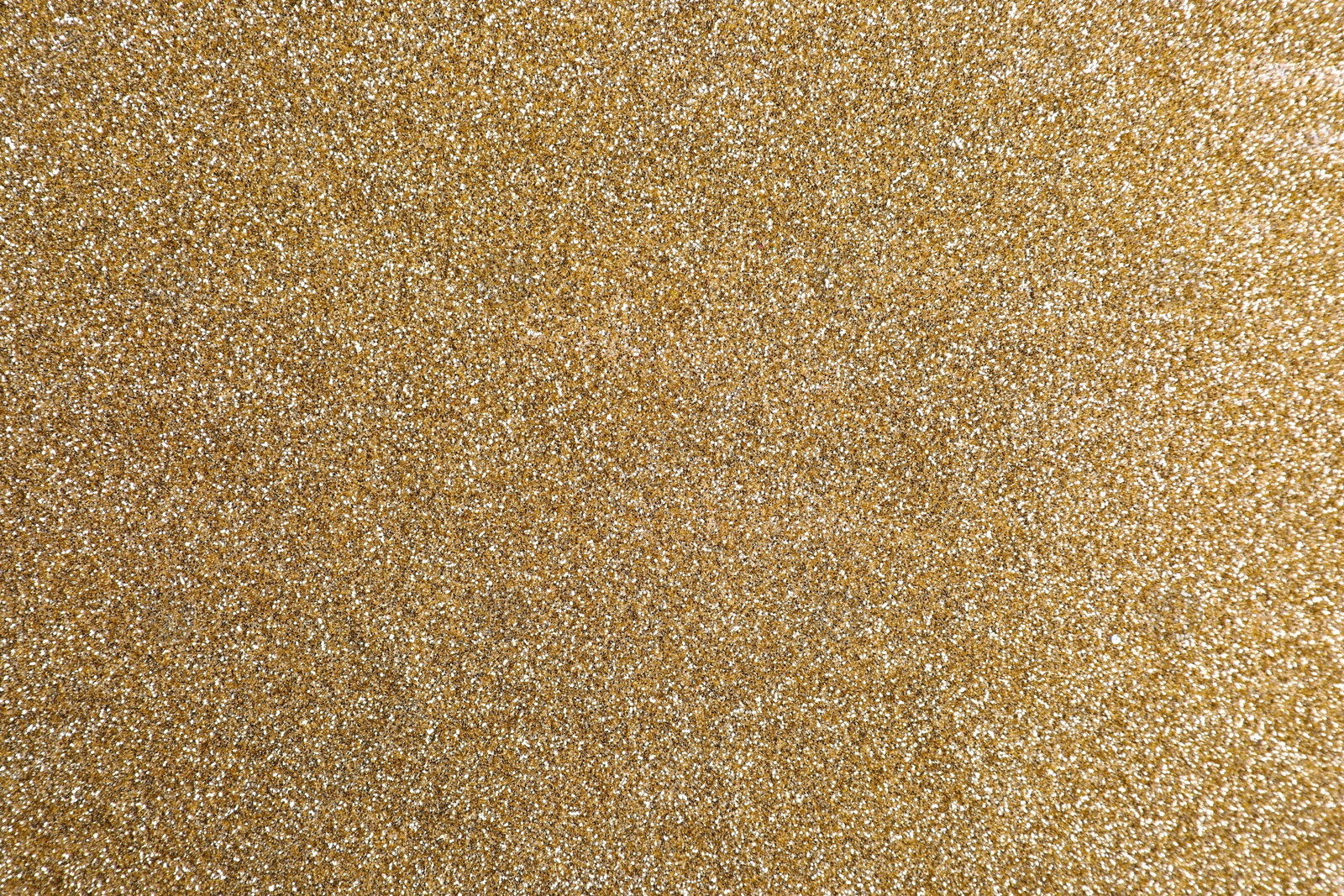 Photo of Beautiful shiny brass glitter as background, closeup