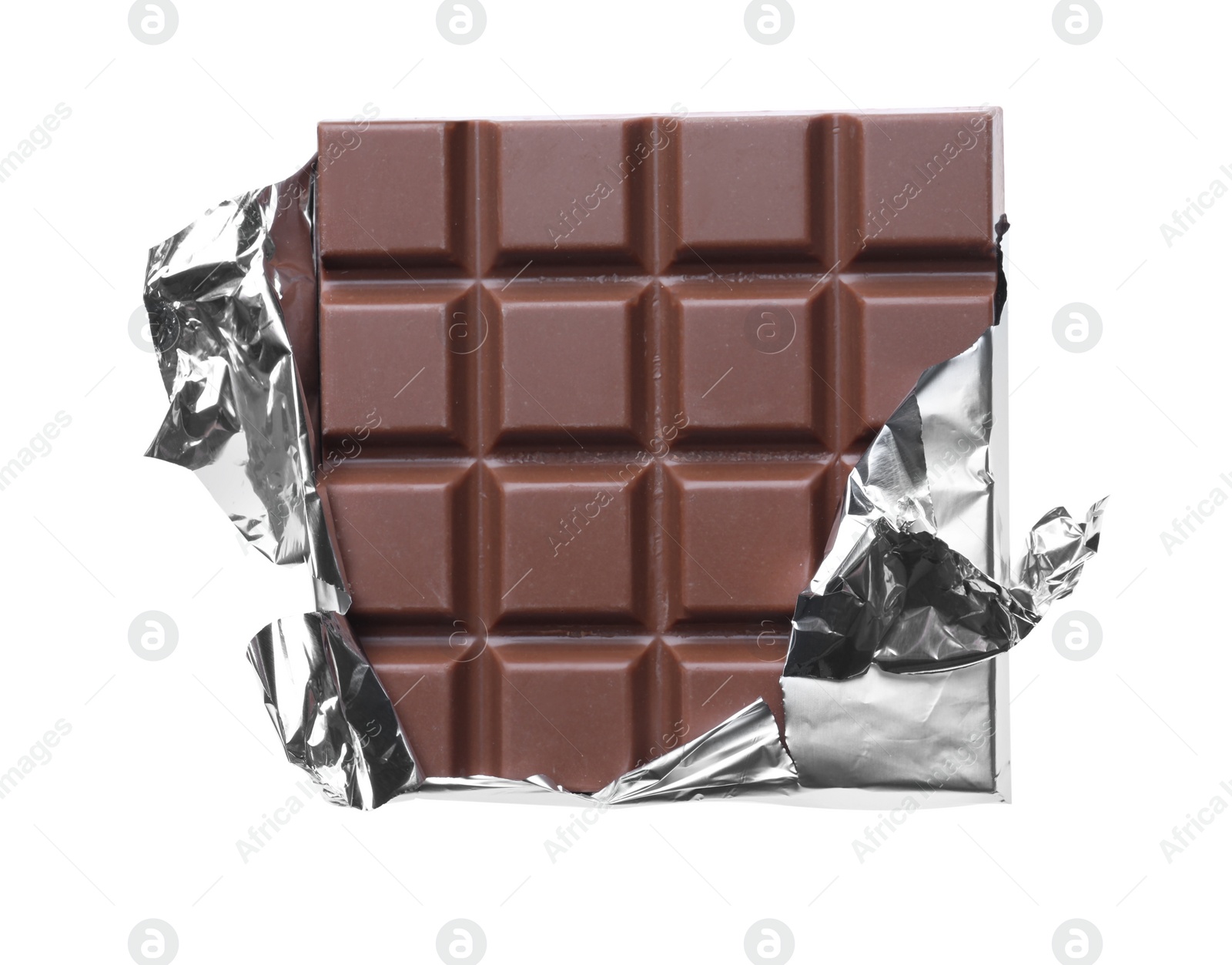 Photo of Delicious milk chocolate bar wrapped in foil isolated on white