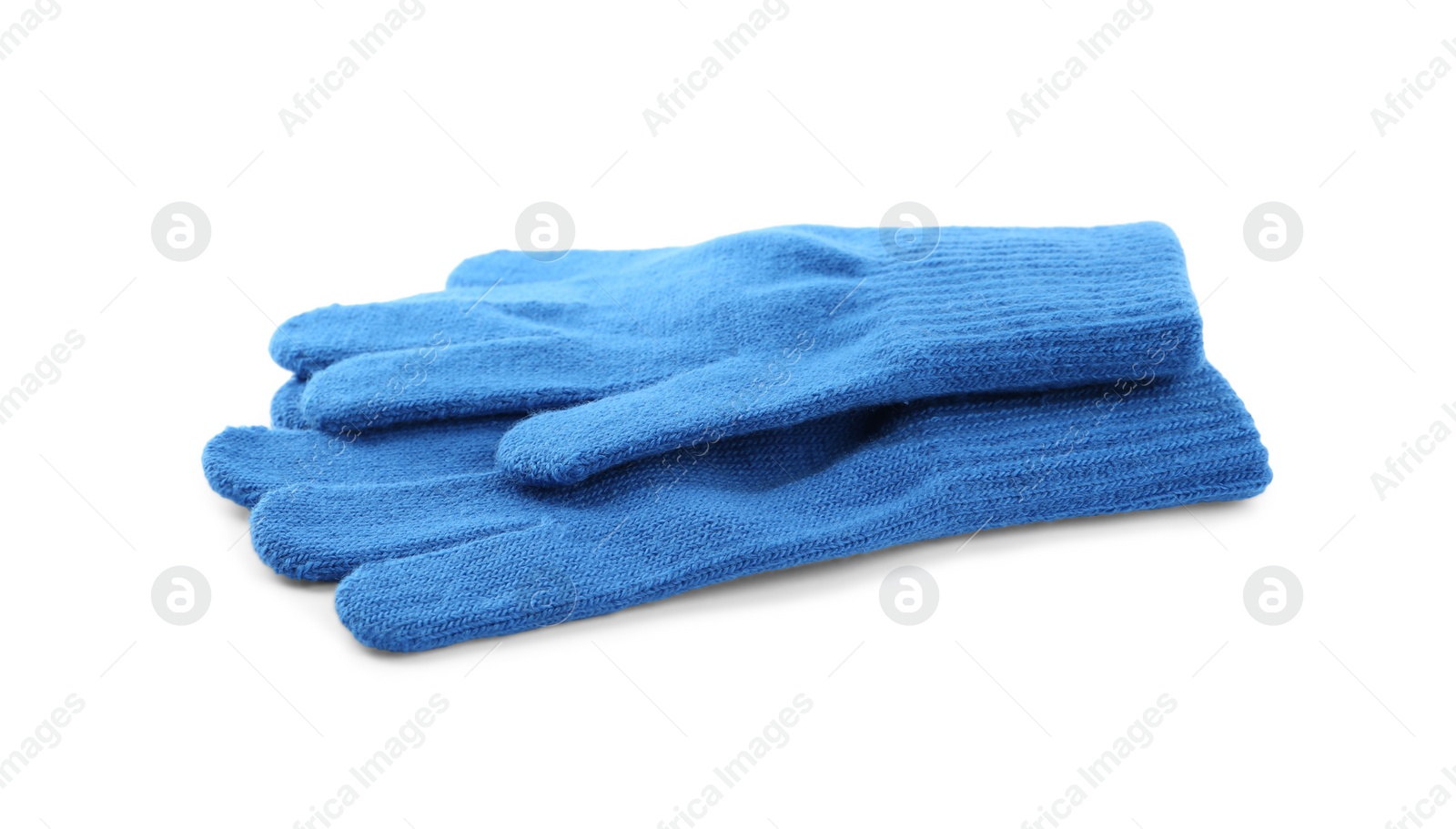 Photo of Blue woolen gloves on white background. Winter clothes