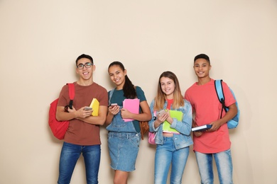 Photo of Group of teenagers on color background. Youth lifestyle and friendship