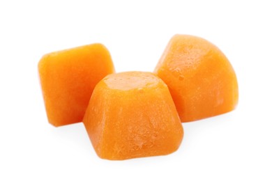 Photo of Frozen fruit puree cubes on white background