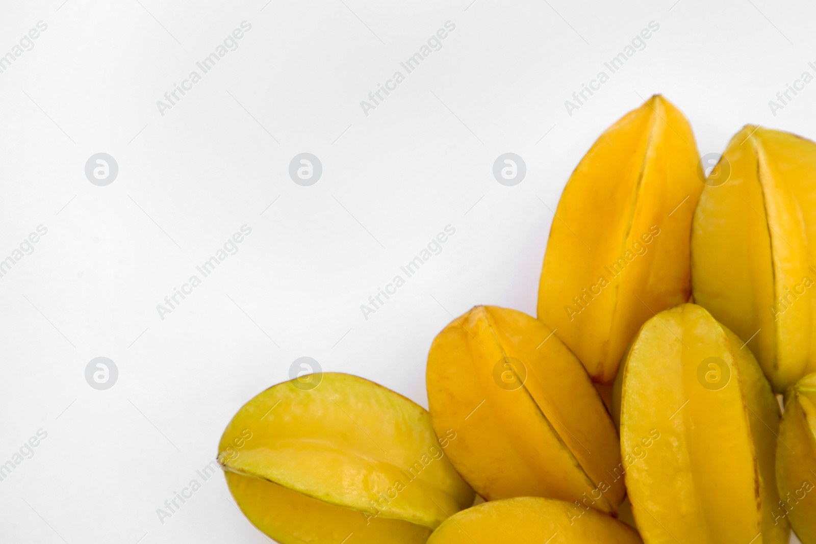 Photo of Delicious ripe carambolas on white background, top view