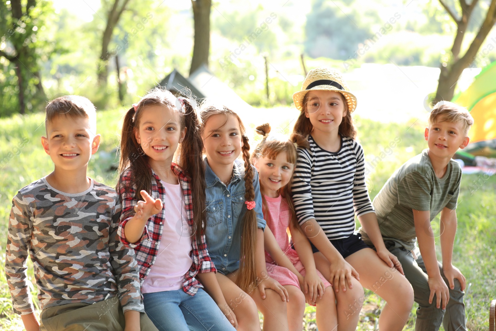 Photo of Little children outdoors on sunny day. Summer camp