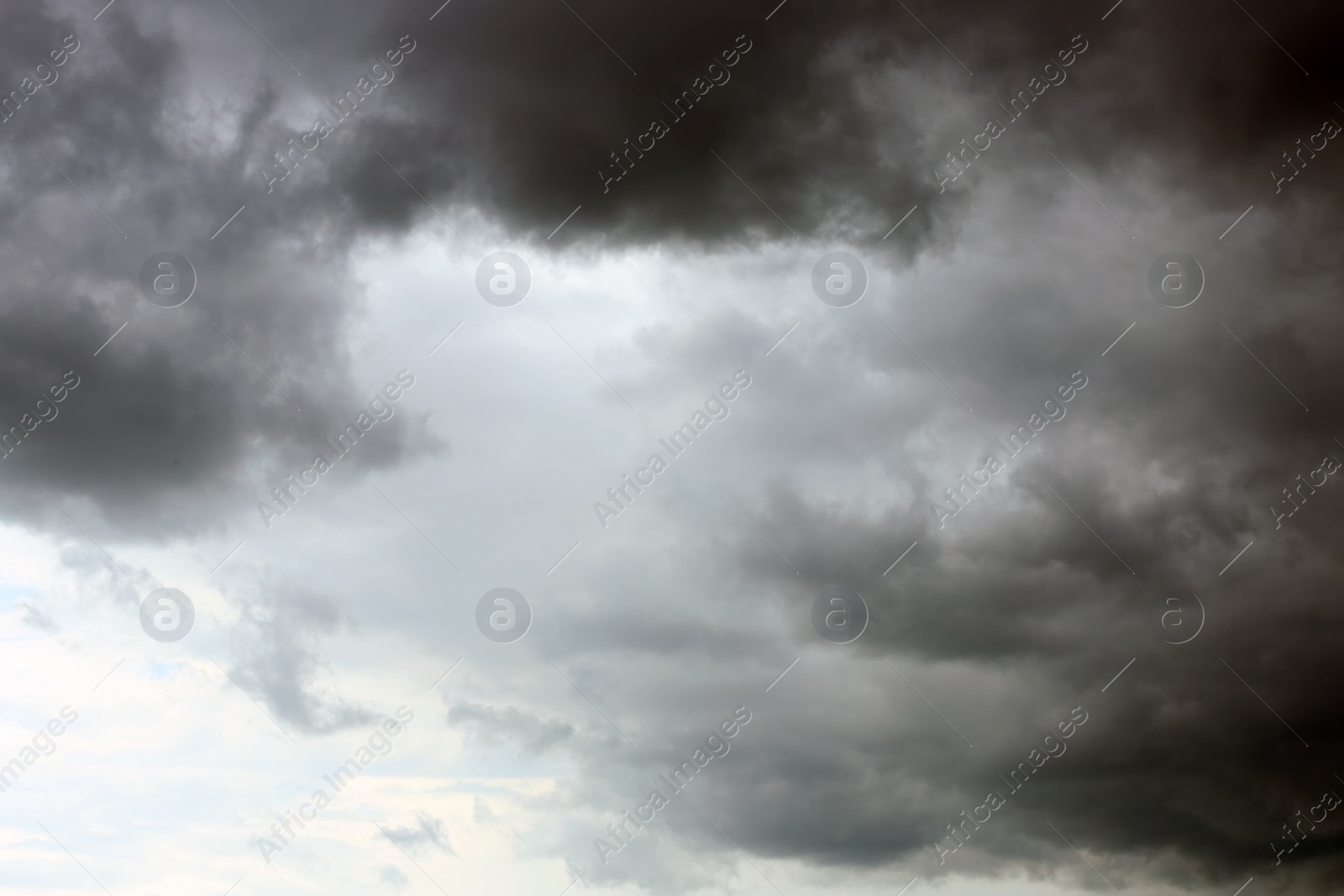 Photo of Sky with heavy rainy clouds on grey day