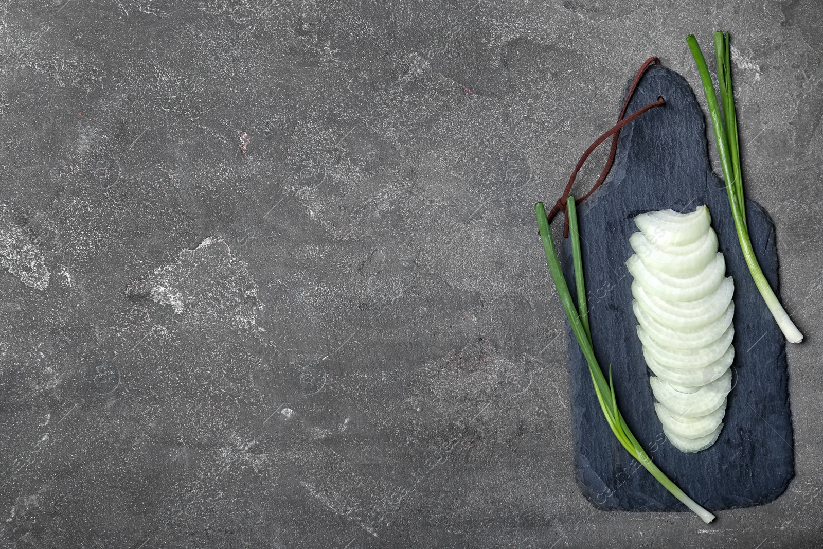 Photo of Flat lay composition with ripe onion on grey background