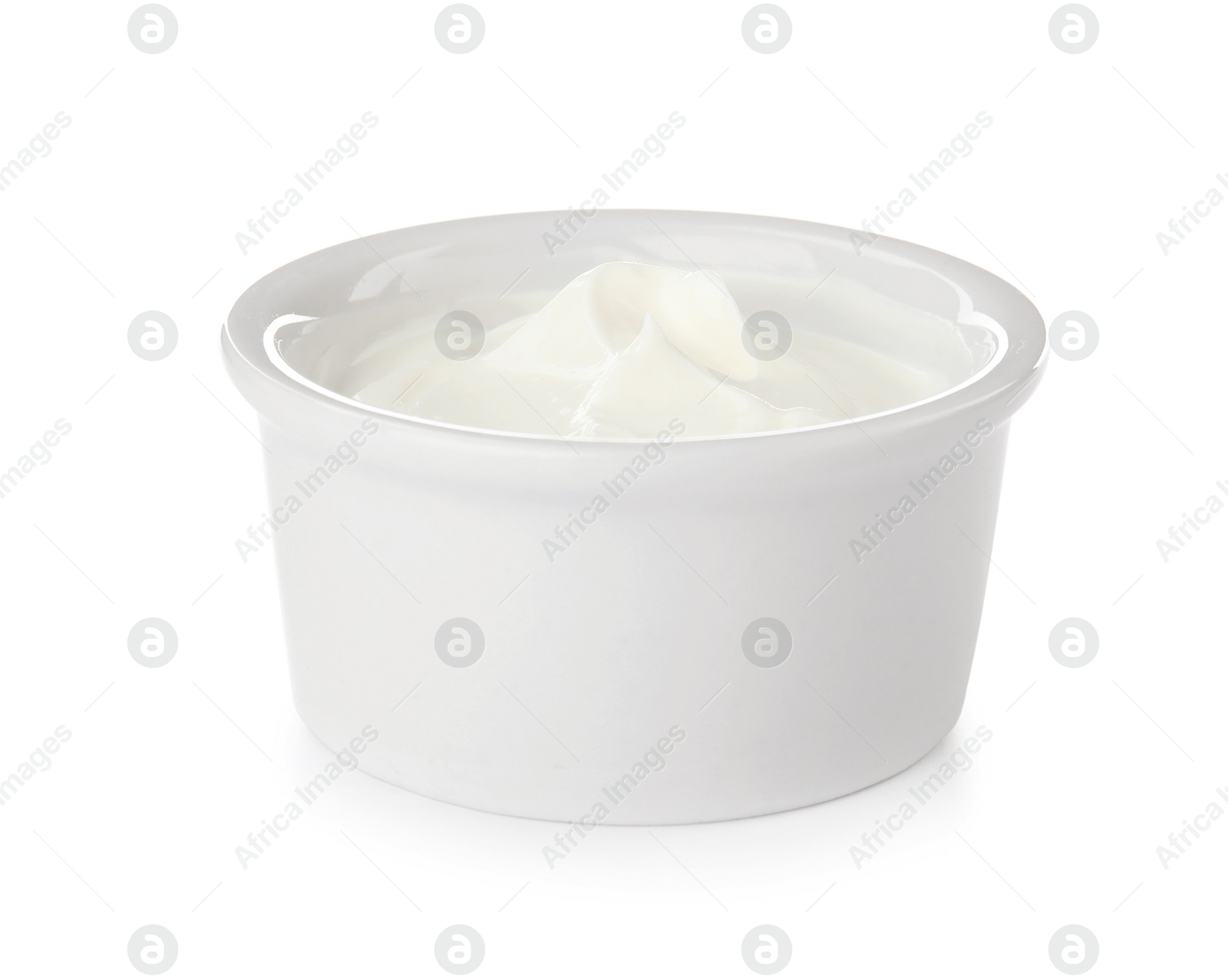 Photo of Bowl with sour cream on white background