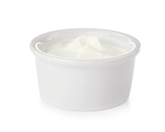 Bowl with sour cream on white background