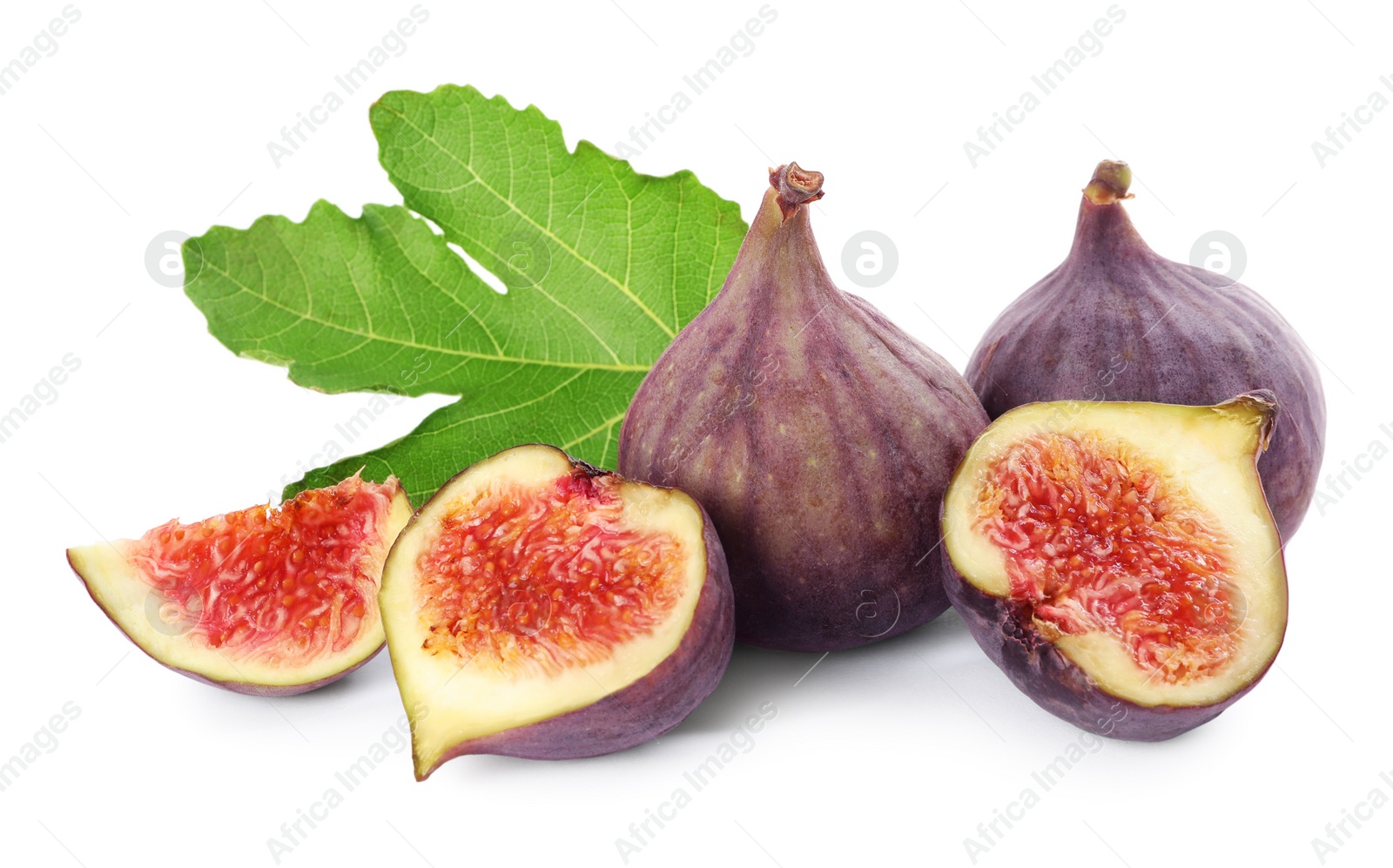 Photo of Tasty whole and cut figs with green leaf isolated on white