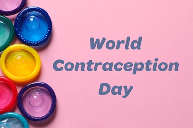 World contraception day. Many colorful condoms on pink background, flat lay