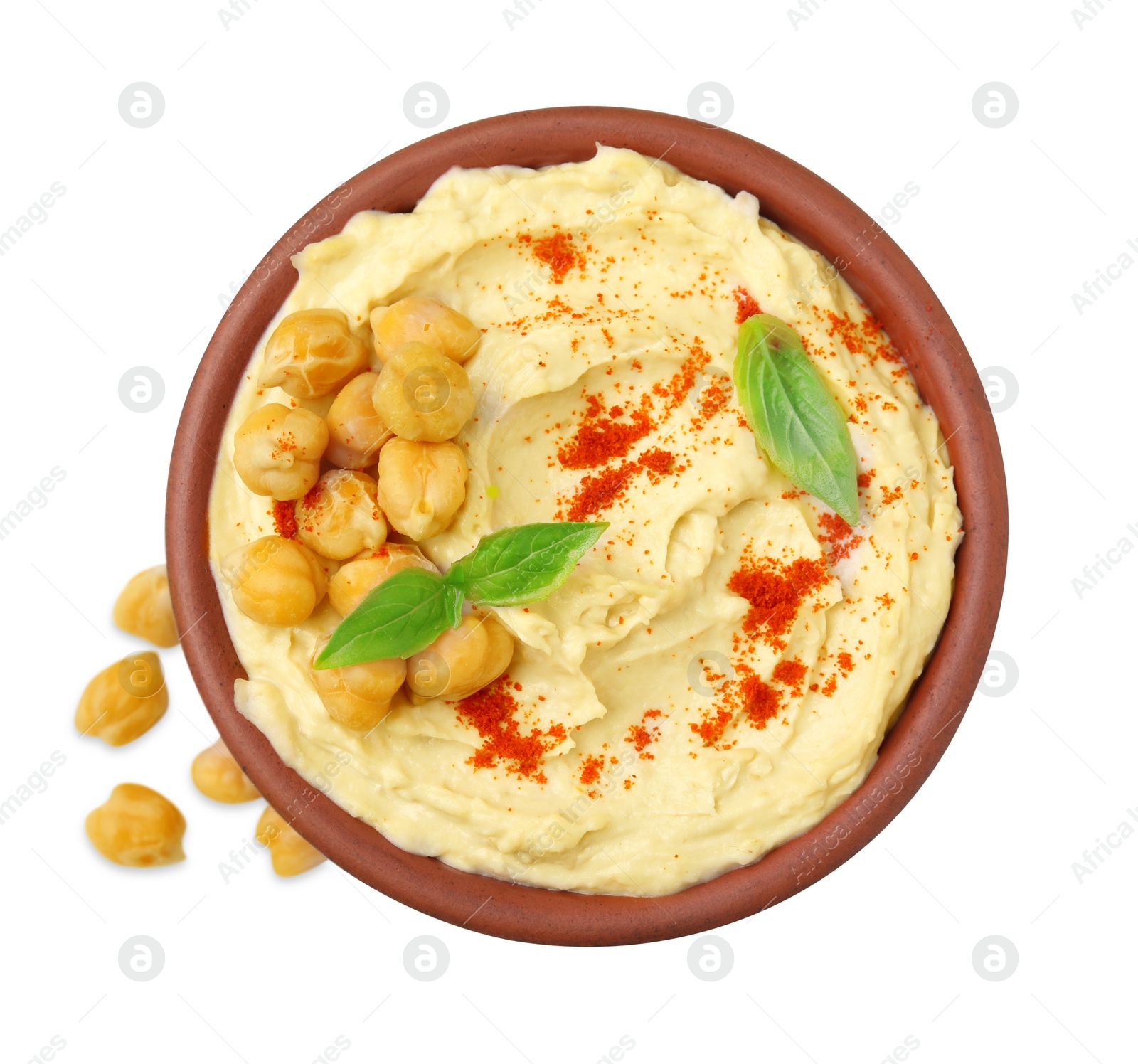 Photo of Bowl of delicious hummus with chickpeas and paprika on white background, top view