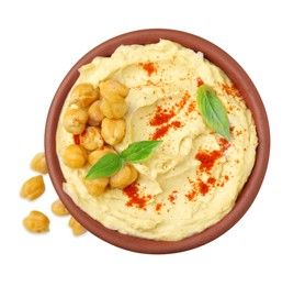 Photo of Bowl of delicious hummus with chickpeas and paprika on white background, top view