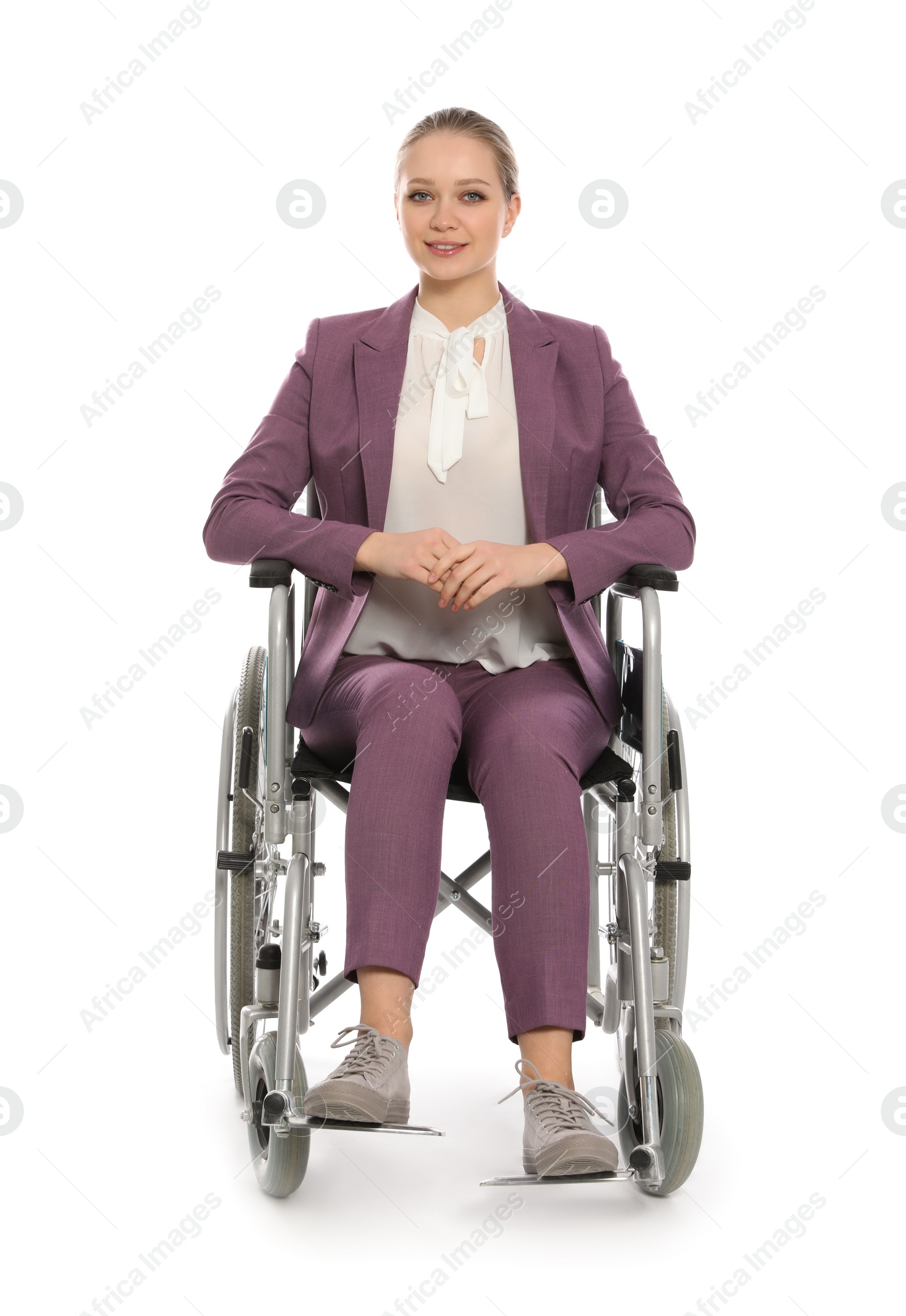 Photo of Beautiful young businesswoman in wheelchair isolated on white