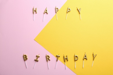 Photo of Flat lay composition with birthday candles on color background. Space for text