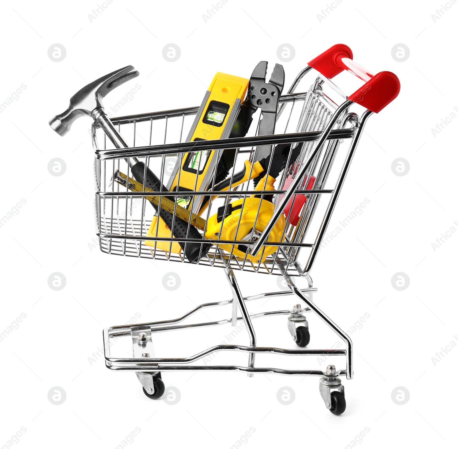 Photo of Small shopping cart with set of construction tools isolated on white