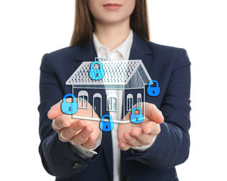 Home security concept. Woman holding house on white background, closeup