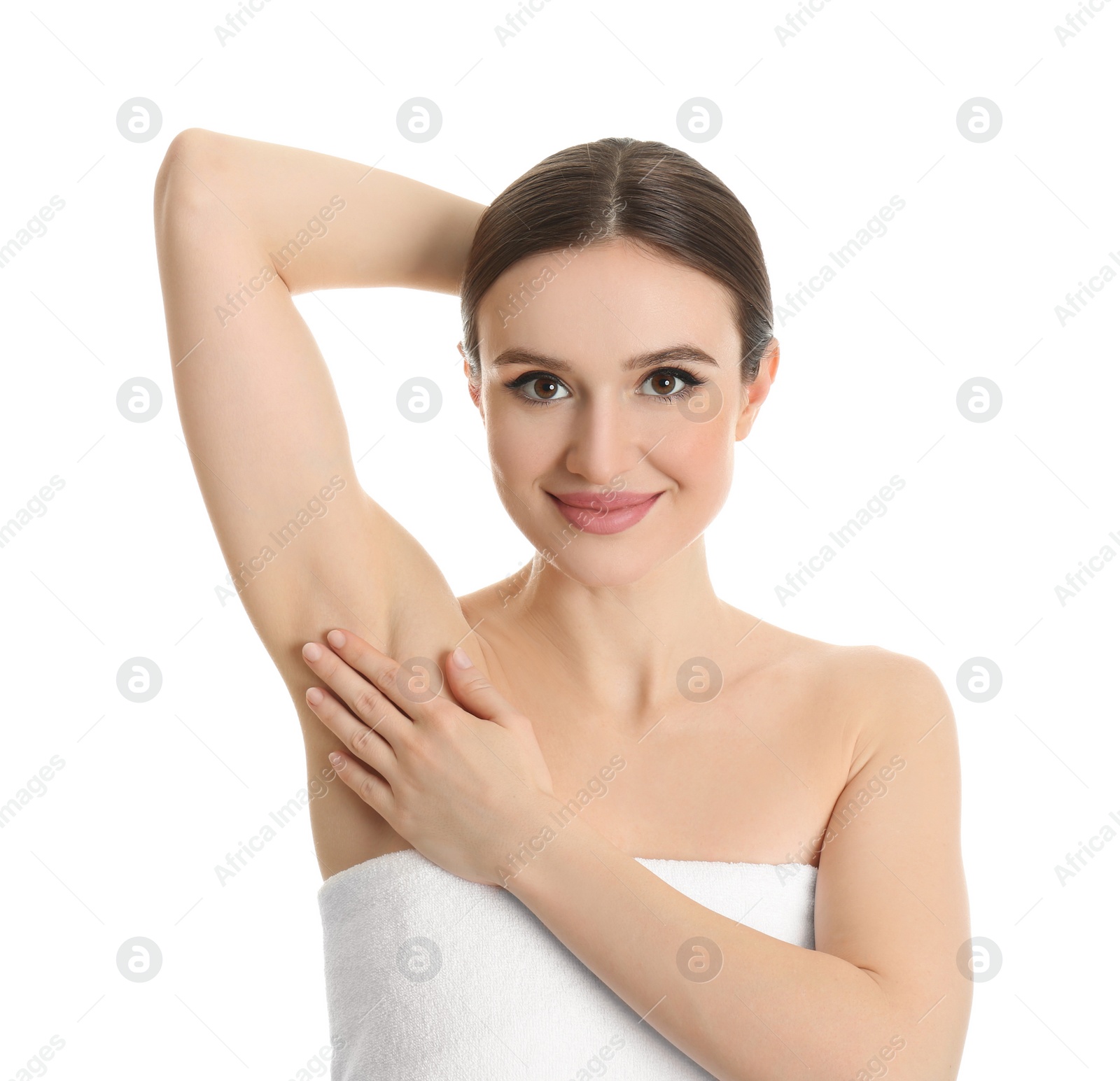 Photo of Young beautiful woman showing armpit with smooth clean skin on white background