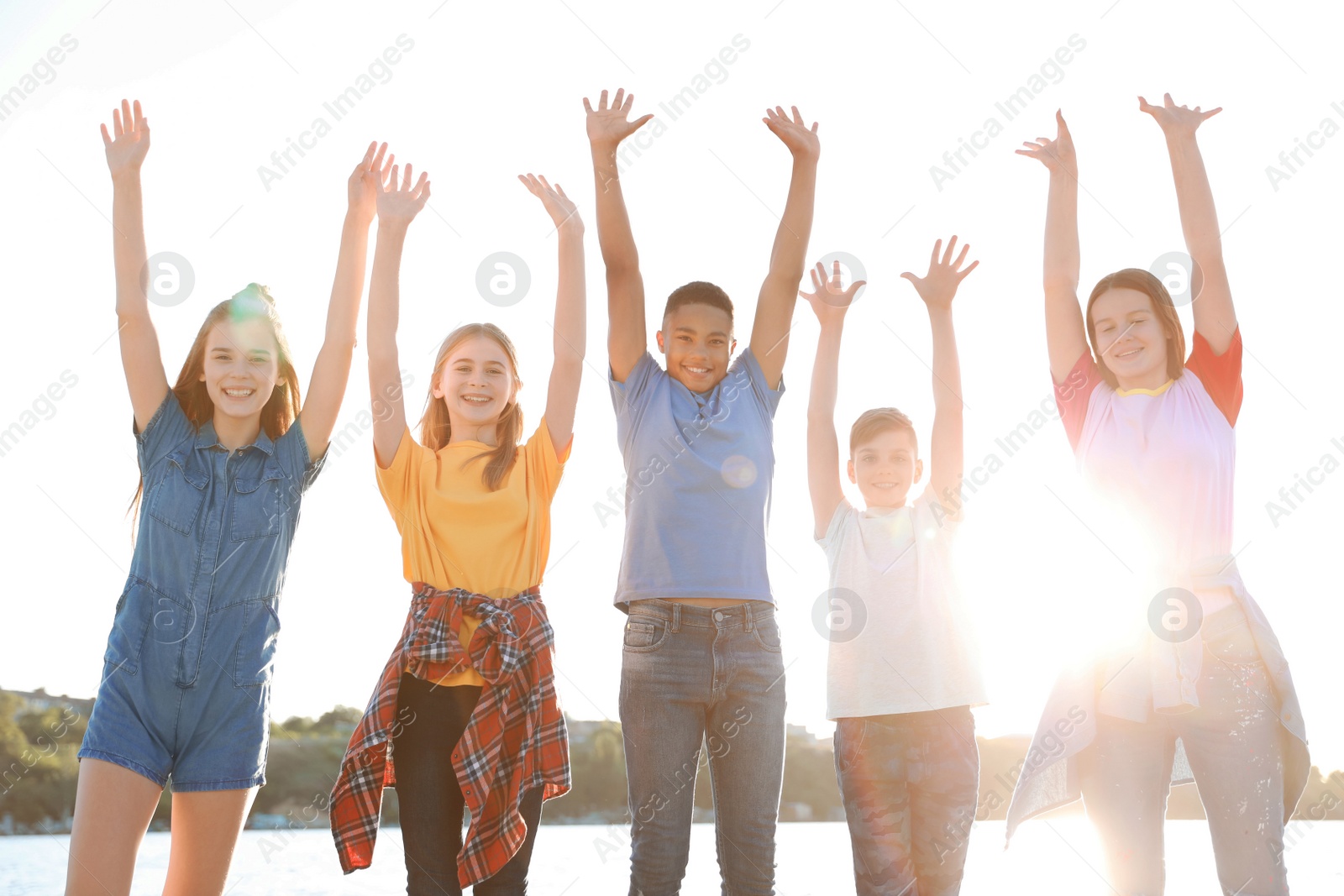 Photo of Group of children outdoors on sunny day. Summer camp