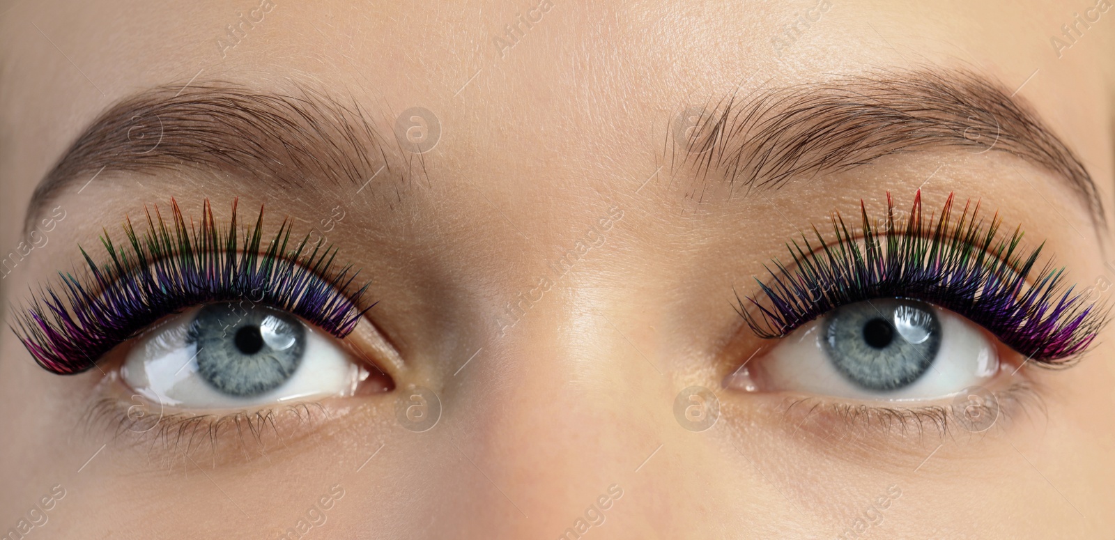 Image of Young woman with long color eyelashes, closeup. Banner design
