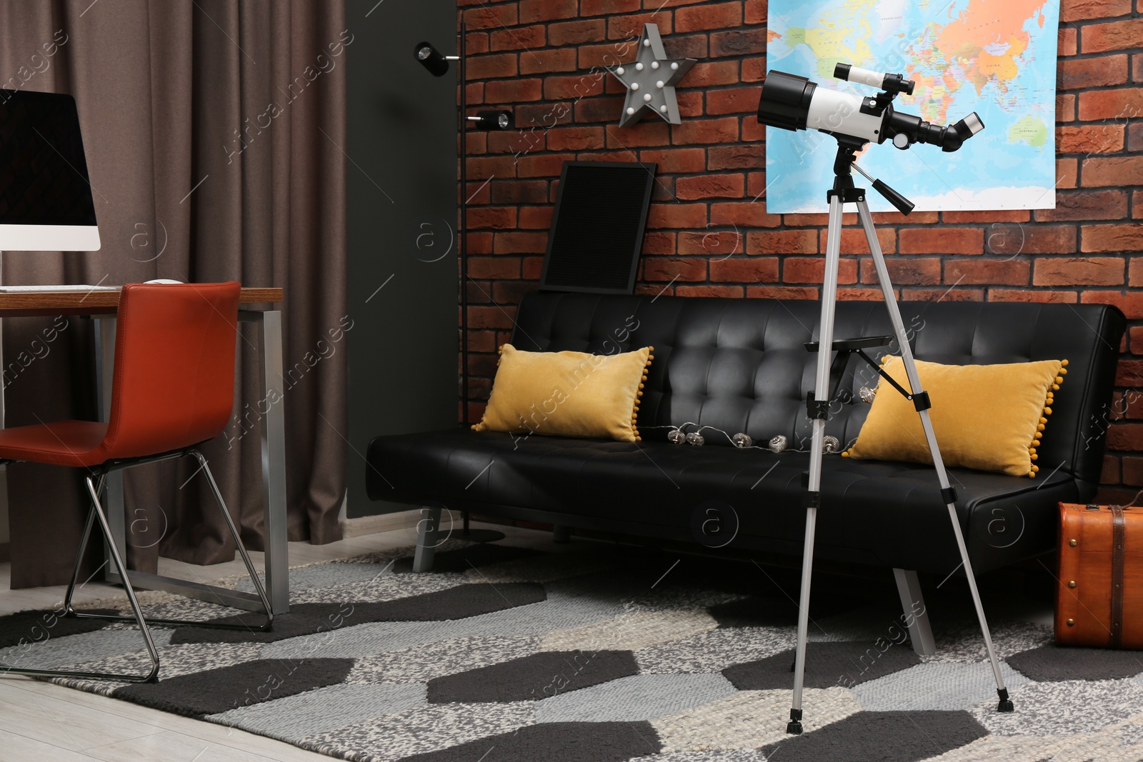 Photo of Tripod with modern telescope in stylish room