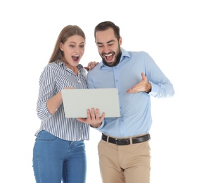 Emotional young people with laptop celebrating victory on white background