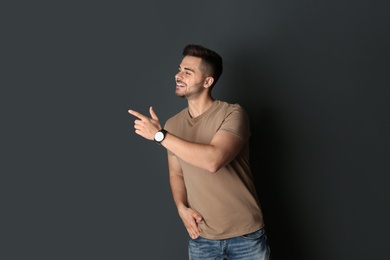 Photo of Portrait of handsome man on dark background