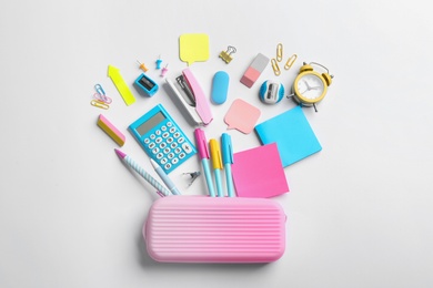 Photo of Flat lay composition with school stationery on white background. Back to school