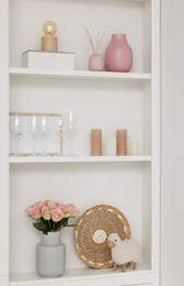 Shelves with different decor in room. Interior design