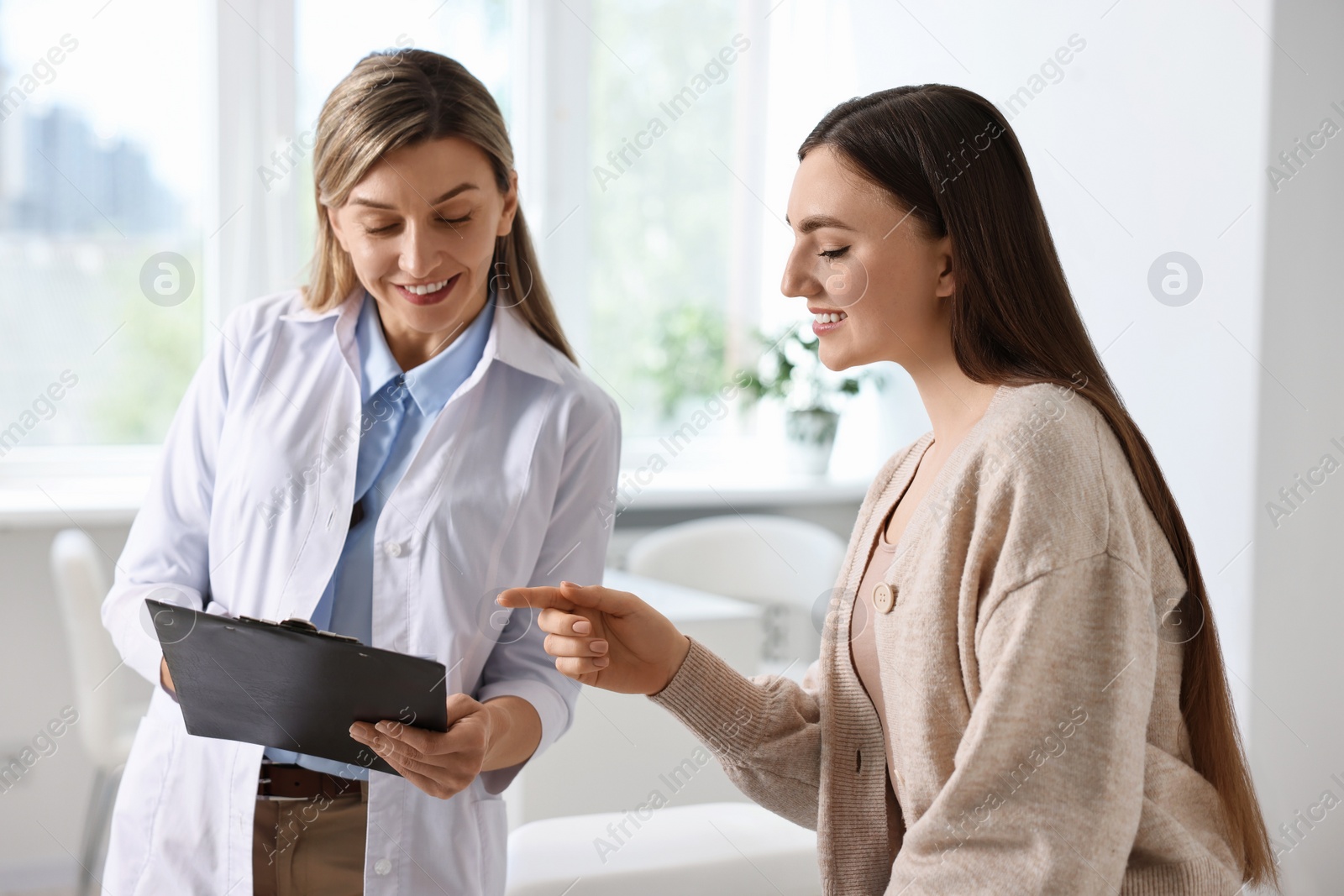 Photo of Professional doctor working with patient in hospital