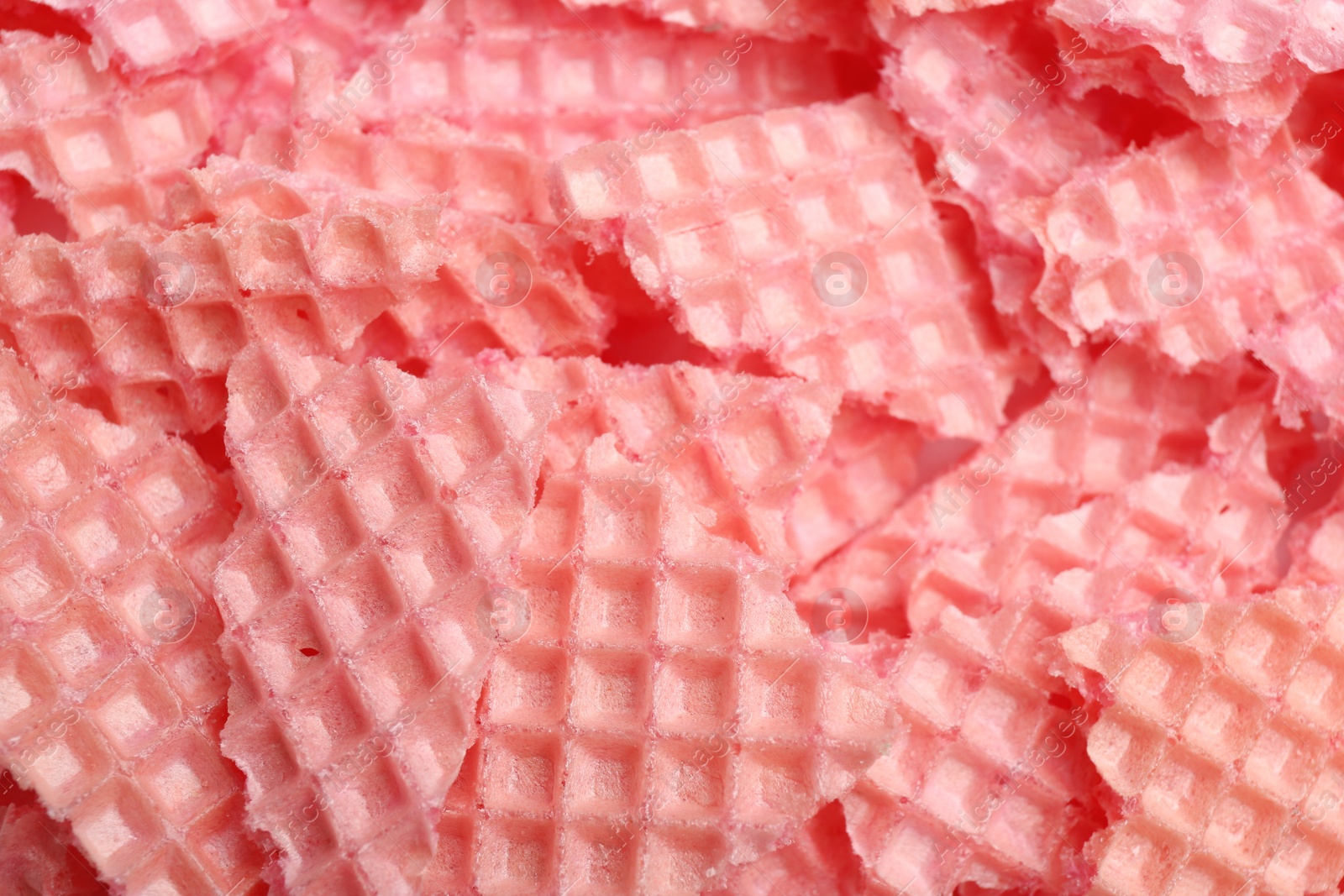 Photo of Tasty crushed wafers as background, closeup. Crispy food