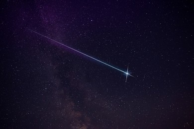 Picturesque view of shooting star in night sky