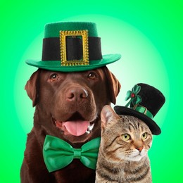 St. Patrick's day celebration. Cute dog and cat with leprechaun hats on green background