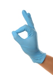 Photo of Person in blue latex gloves showing okay gesture against white background, closeup on hand