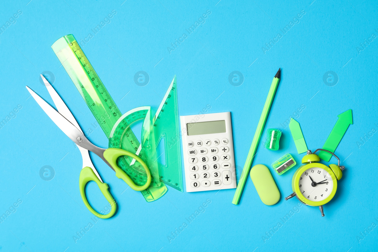 Photo of Different stationery on light blue background, flat lay. Back to school