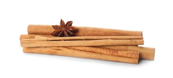 Aromatic cinnamon sticks and anise isolated on white