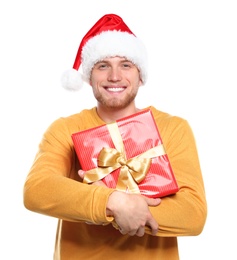 Photo of Young man with Christmas gift on white background