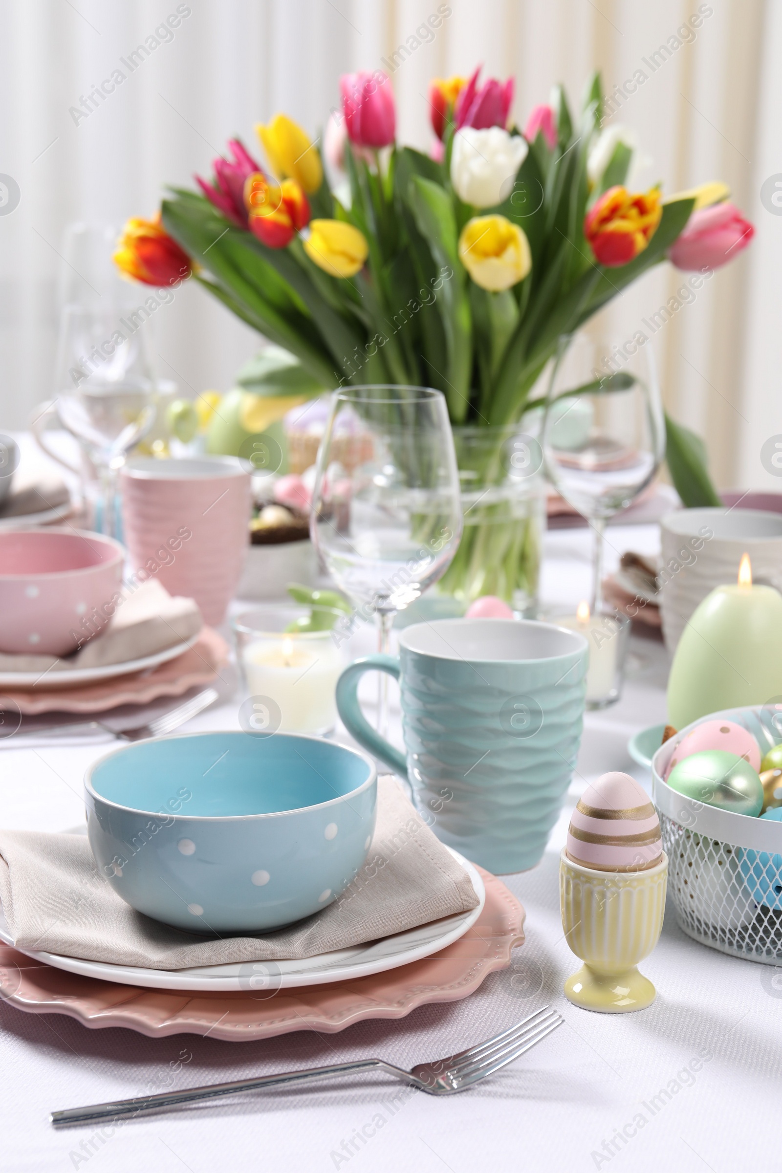 Photo of Festive table setting with beautiful flowers. Easter celebration