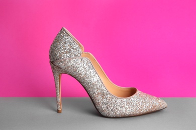 Photo of Female shoe on color background