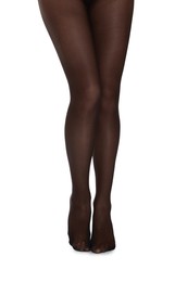 Photo of Woman with beautiful long legs wearing black tights on white background, closeup