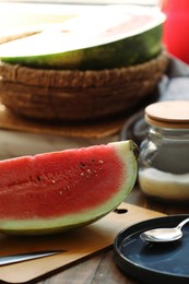 Photo of Slice of fresh juicy watermelon on wooden table, closeup