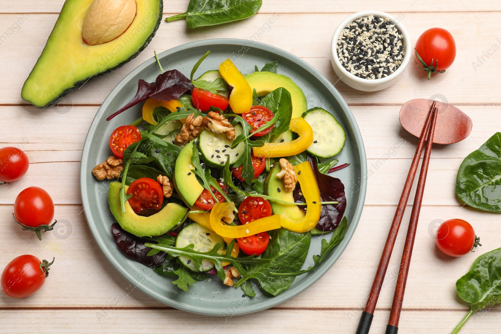 Photo of Balanced diet and vegetarian foods. Plate with different delicious products on wooden table, flat lay