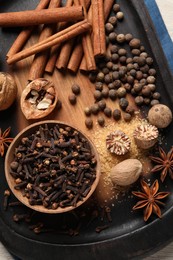 Photo of Different aromatic spices on table, top view