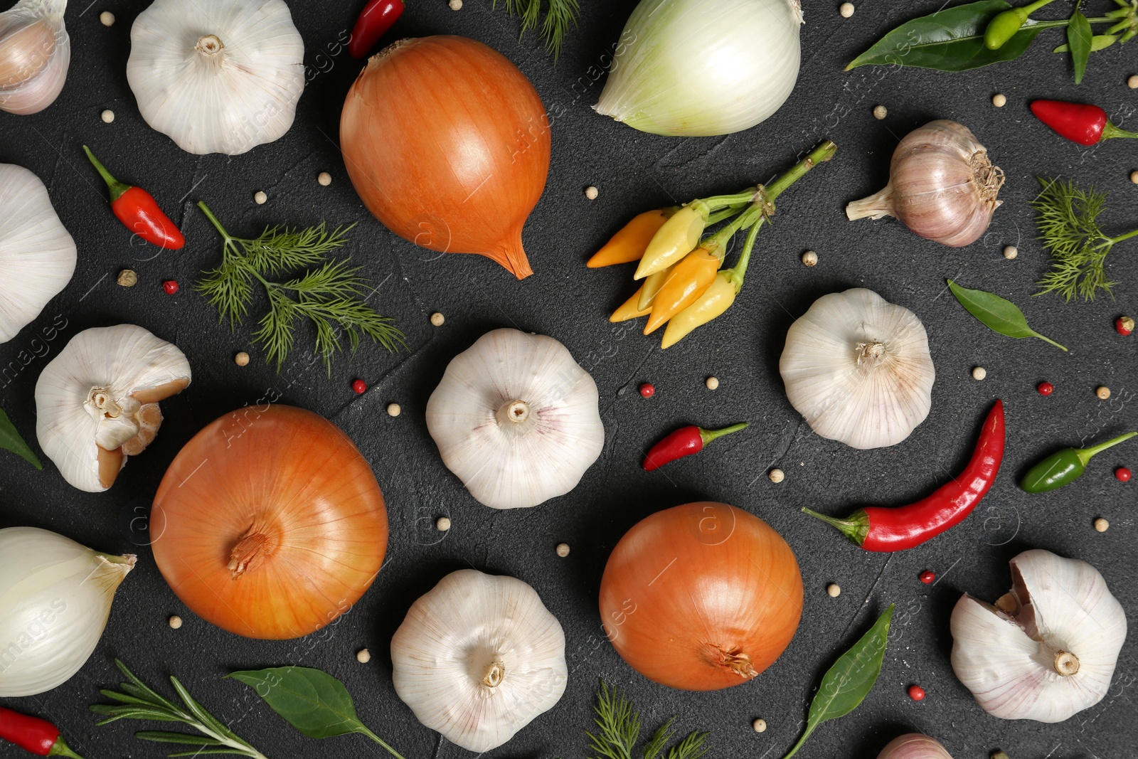 Photo of Flat lay composition with garlic and onion on table