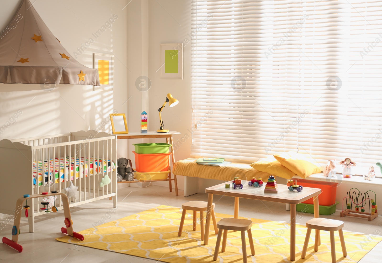 Photo of Cozy baby room interior with comfortable crib